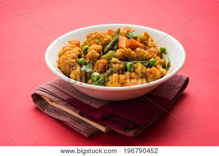indian spicy food Gobi matar Masala or cauliflower curry with green peas or phool gobi fry, selective focus
