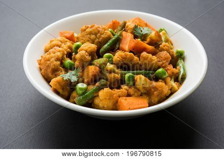 indian spicy food Gobi matar Masala or cauliflower curry with green peas or phool gobi fry, selective focus