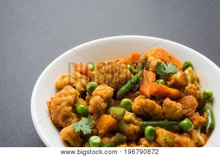 indian spicy food Gobi matar Masala or cauliflower curry with green peas or phool gobi fry, selective focus