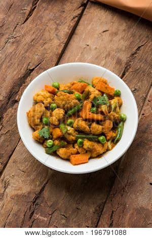 indian spicy food Gobi matar Masala or cauliflower curry with green peas or phool gobi fry, selective focus