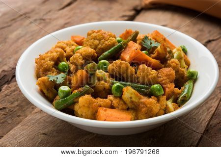 indian spicy food Gobi matar Masala or cauliflower curry with green peas or phool gobi fry, selective focus
