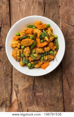 indian spicy food Gobi matar Masala or cauliflower curry with green peas or phool gobi fry, selective focus