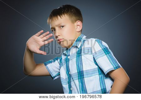 Closeup Scared and shocked little boys. Studio shot portrait over gray background. Human emotion face expression. Life perception achievement vision.