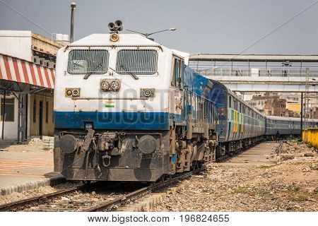 Atrain arriving at the railway station in agra india unesco site.
