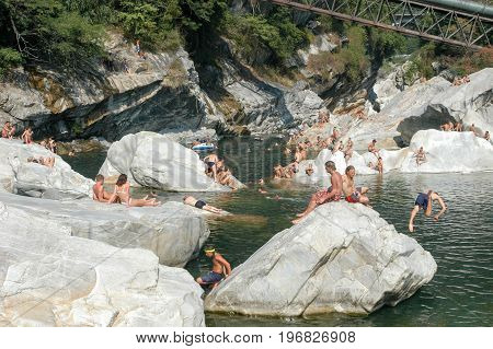 People Swimming And Sunbathing On Maggia River At Ponte Brolla