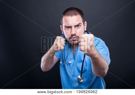 Mad Doctor Wearing Scrubs With Stethoscope Fighting