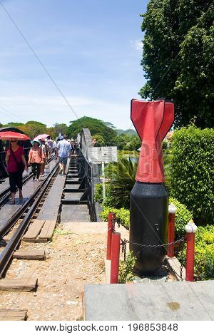 Kanchanaburi Thailand May 17 2013: Unexploded projectile on the background of the road of death.