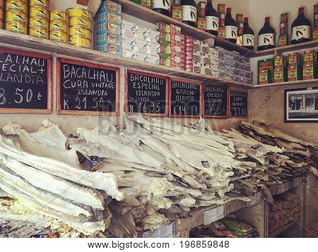 LISBON PORTUGAL - NOWEMBER 19 2016: Vintage shop with Portugese Bacalhau fish in Lisbon local product