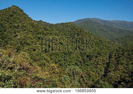 Overview of hills and peaks covered by forests in the Itatiaia Park, an altitude park, known for its animal diversity, trails and waterfalls. Located in the Rio de Janeiro State, southwestern Brazil
