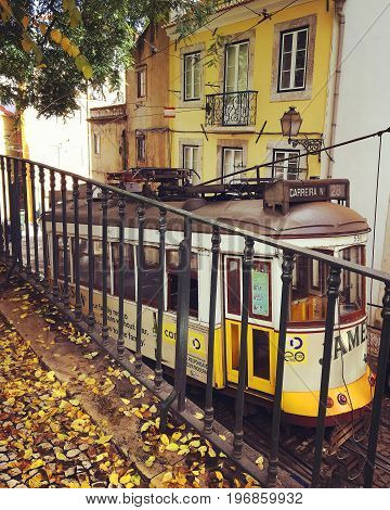 LISBON PORTUGAL - NOWEMBER 21 2016: Vintage yellow tram number 28 in Lisboa Portugal