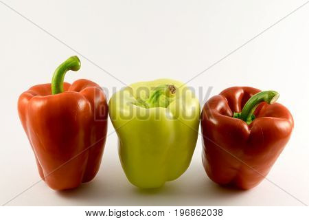 colored fresh peppers. Isolated on white background