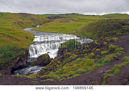 Waterfall Cascade On The Iceland Trek In Green Nature