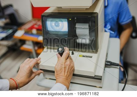 Close Up Of Eye Doctor/optometrist/ophthalmologist Examinating A Young Patient