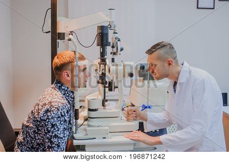 Young Beautiful Doctor/eye Specialist/optometrist In An Ophthalmologic Clinic