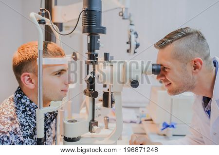 Young Beautiful Doctor/eye Specialist/optometrist In An Ophthalmologic Clinic