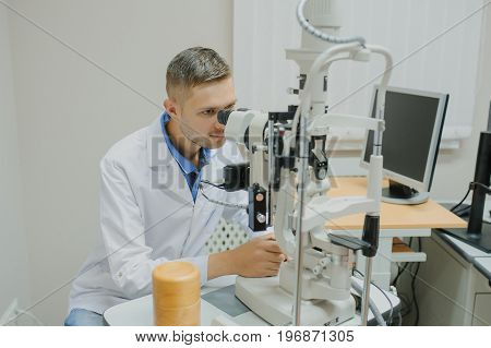 Young Beautiful Doctor/eye Specialist/optometrist In An Ophthalmologic Clinic