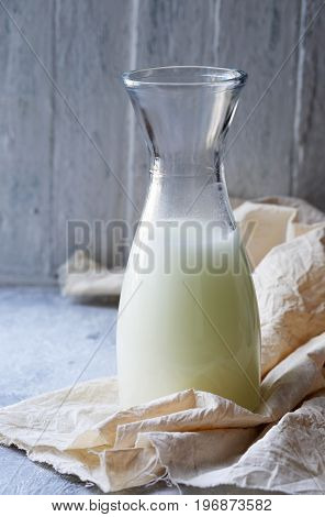 Homemade serum in a Pitcher in rustic style
