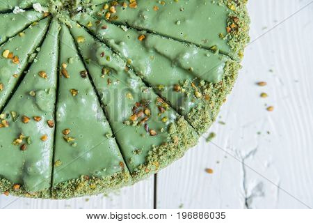 Close up green sliced pistachio cake top view