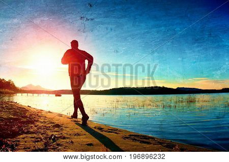 Film Grain. Sportsman Running At Amazing Summer Sunset Along Coastline In Sport And Healthy Possitiv