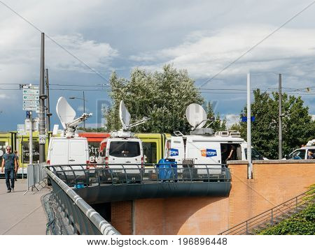 STRASBOURG FRANCE - JUN 30 2017: RTL N:TV TV Media Television Trucks with multiple Satellite parabolic antennas and fiber optic cables preparing to report live the official European Ceremony of Honour for Dr. Helmut Kohl at European Parliament