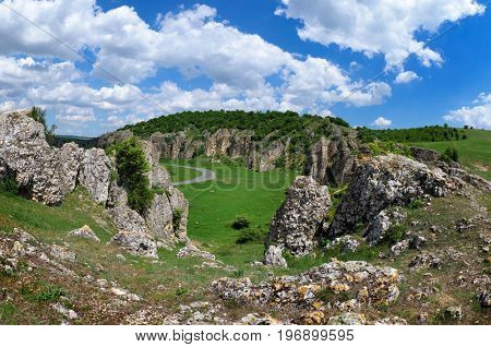 mountain landscape with some of the oldest limestone rock formations in Europe in Dobrogea Gorges (Cheile Dobrogei) Romania