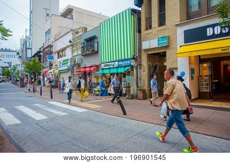 HAKONE, JAPAN - JULY 02, 2017: Unidentified people walking at street. It also provides bus stop for Hakone Tozan Bus back to Hakone-Yumoto and Odawara.