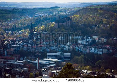 MARBURG GERMANY - APRIL 18 2015: The new and the old part of the city from the surrounding hills. Marburg is a university town in the German federal state (Bundesland) of Hessen.