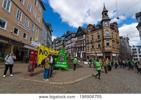MARBURG GERMANY - APRIL 18 2015: Protest Greenpeace activists in the historic center of the city against the Transatlantic Trade and Investment Partnership (TTIP).