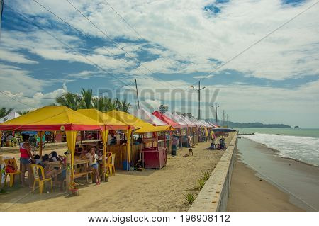 ATACAMES, ECUADOR - March 16, 2016: Unidentified people under a small and rustic tents in Same, Ecuador.