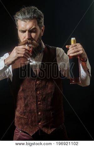Man With Bottle Drinking Glass Of Red Wine