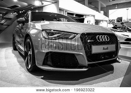 BERLIN - MAY 02 2015: Showroom. Hot hatch Audi RS3 (8VA). Black and white. Produced since 2015.