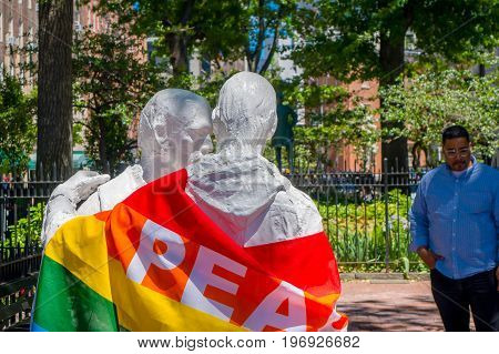 ORLANDO, USA - MAY 05, 2017: Staue with a gay flag with the word peace, in shooting memorial gay in Orlando, Florida, United States.