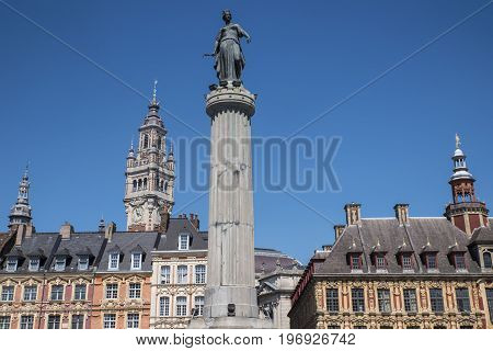 View in Grand Place in the historical city of Lille France. The view includes the Column of the Goddess Vieille Bourse and the Chamber of Commerce and Industry.