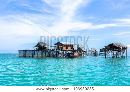 The traditional sea gypsy water village in Bodgaya Island in Tun Sakaran Marine Park,Semporna,Sabah,Borneo,Malaysia.Clear blue water & sandy beach.Beautiful vacation & destination.
