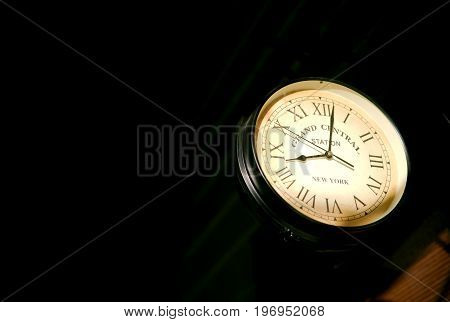 Image of a clock showcasing mock grand central station and railway station time.