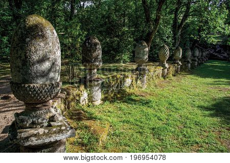 Bomarzo, Italy - May 20, 2013. View of sculpture amidst the vegetation in the Park of Bomarzo. Also known as Park of Monsters, it was created to surprise the visitor with surrealistic works in stone. Lazio region, central Italy