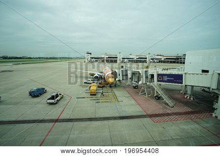 BANGKOK, THAILAND 21 JULY 2017. NOKAIR airline loading cargo on the plane at the gate in Don Mueang international airport (DMK)