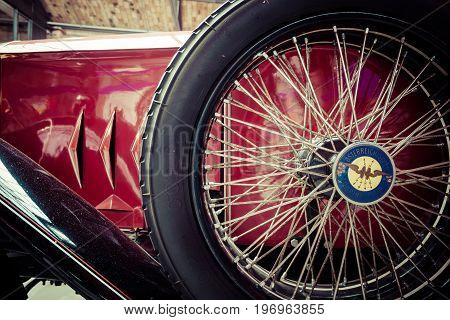 BERLIN - MAY 10 2015: Fragment of retro car EGO 4/14 PS 1923. Stylization. Vintage toning. 28th Berlin-Brandenburg Oldtimer Day