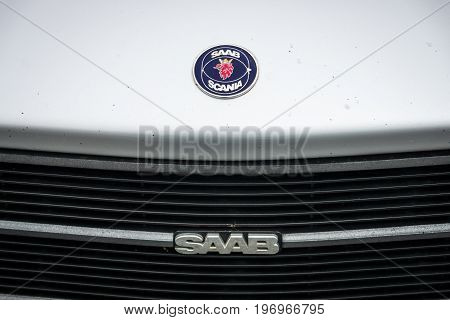 BERLIN - MAY 10 2015: Emblem of a compact executive car Saab 900. The 28th Berlin-Brandenburg Oldtimer Day