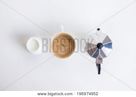 Top View Of French Press, Cup Of Coffee And Milk Jar Standing In Row, Isolated On White