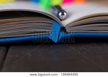 Planning your day A day blank day planner with a blue pen