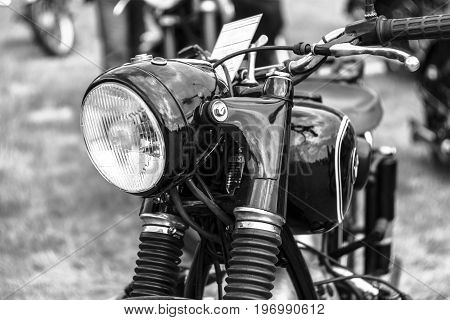 PAAREN IM GLIEN GERMANY - MAY 23 2015: Detail of motorcycle BMW R51 / 3 1955. Stylization. Black and white. The oldtimer show in MAFZ.