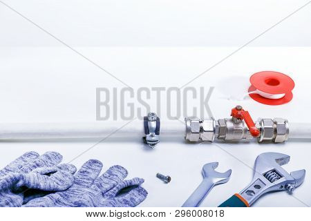 Plumbing Tools On White Surface With Copy Space. Repair Plumbing Concept.