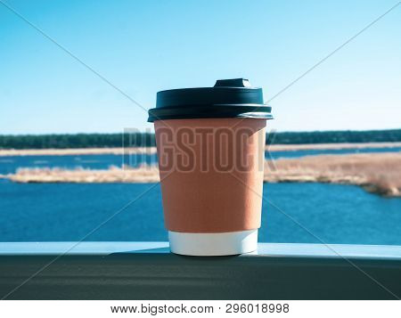 Paper Cup Of Coffee On Natural Morning Background. Film Effect.