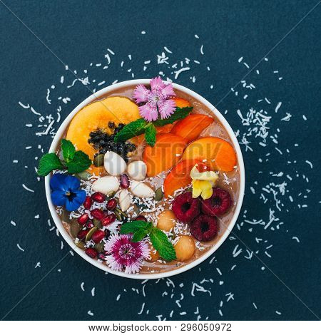 Isolated Shot Of Bowl With Tropical Fruit Decorated With Flowers, Mint, Coconut Flakes Isolated Over