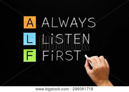 Hand Writing Always Listen First - Alf Acronym Concept With White Chalk On Blackboard.