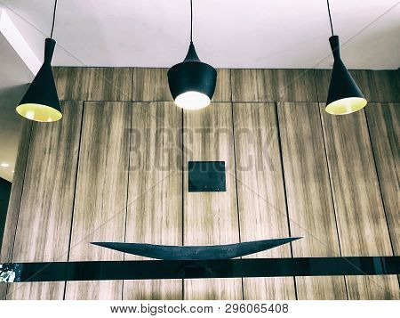 Black Decorative Lamps Hangs From The Ceiling. A Modern Chandelier At Home