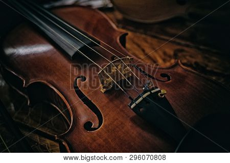 The Abstract Artdesign Background Of Violin Front Side On Wooden Timber Board,blurry Light Around