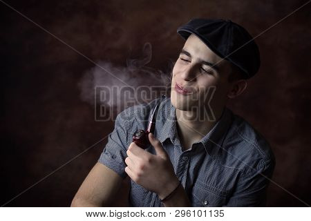 Young Man Smoking A Pipe. Happy, Smiling. Retro Concept