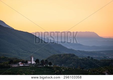 Small Village Kojsko With Chirch Križ On The Hill On Sunrise Between The Vineyards In The Wine Regio